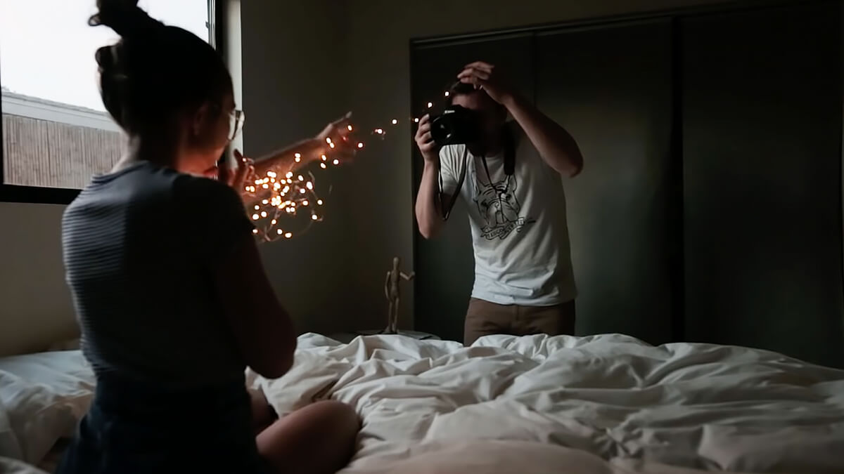 Premium Photo | A girl with a christmas garland. light in hands, in the  form of a heart